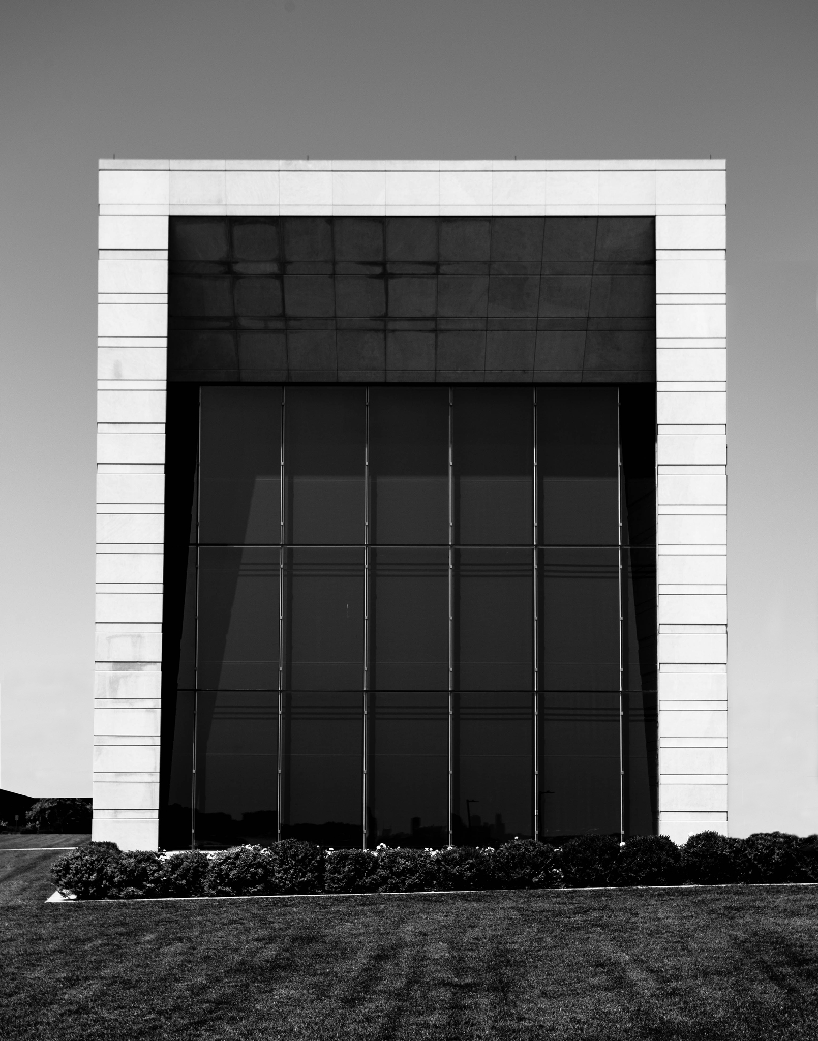The monumental limestone frame and dark glass of the Ryan Center's recital-hall wing